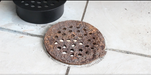 Replacing Old Rusty Cover with Stainless Steel Garage Drain Cover for Standard PVC Pipe